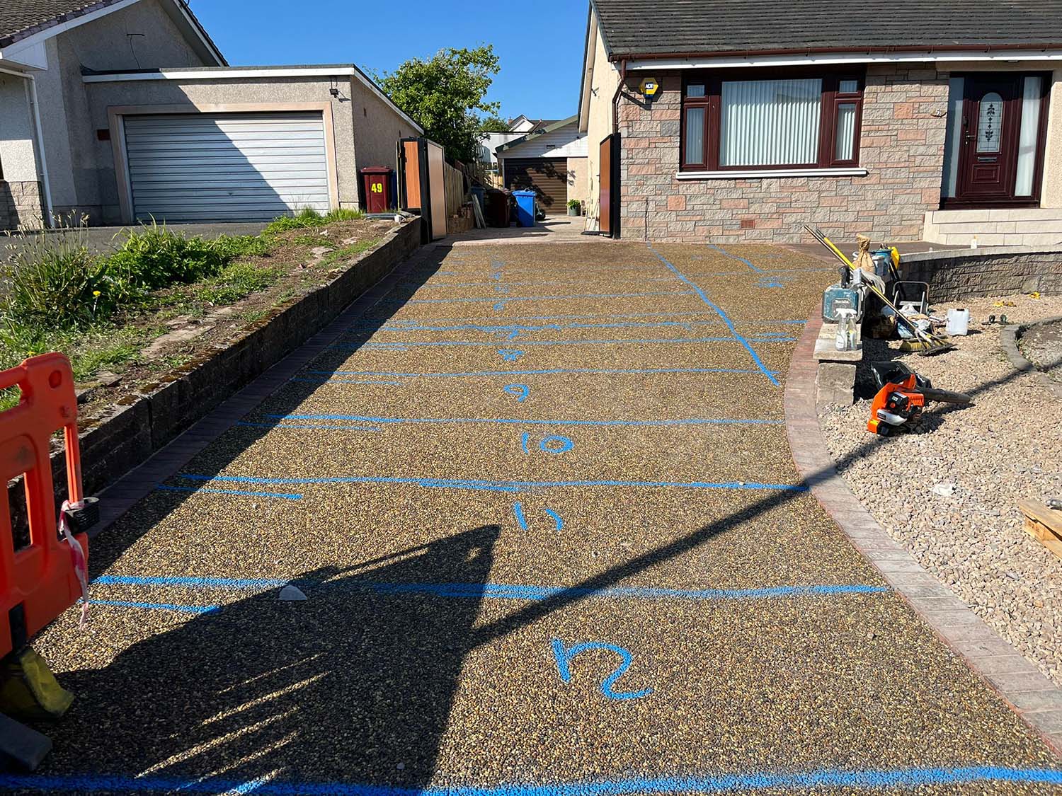 0dfee1af-137f-41f8-9299-7cba68ba7664 Driveway marked out before laying a new resin bound driveway in Glasgow