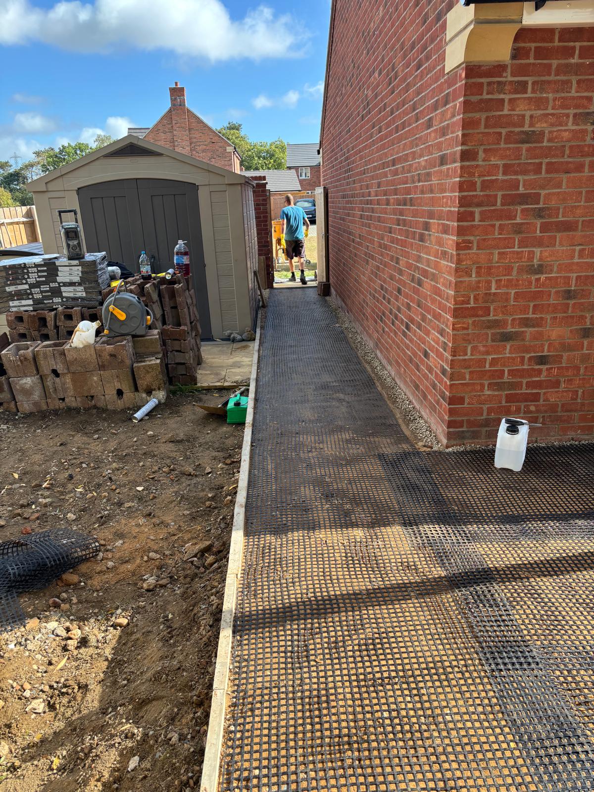 611588d2-a390-4446-aeec-06f5f2a8ee25 Prep layer before laying resin bound surfacing around a house in Glasgow